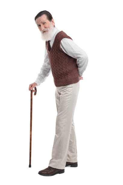 istock Senior man with walking cane on white background 1653452826