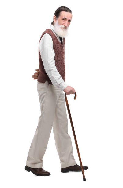 istock Senior man with walking cane on white background 1653452827