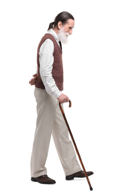 istock Senior man with walking cane on white background 1653452843