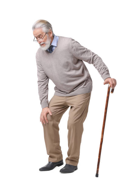 istock Tired senior man with walking cane on white background 1653453392