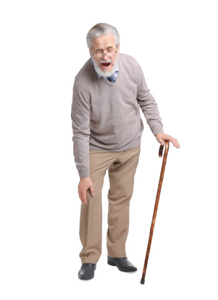 istock Senior man with walking cane suffering from knee pain on white background 1653453401