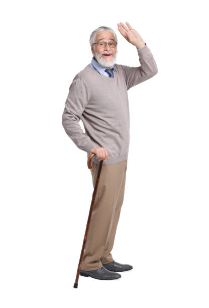 istock Senior man with walking cane on white background 1653453596