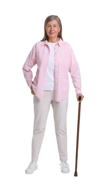 istock Senior woman with walking cane on white background 1653453933