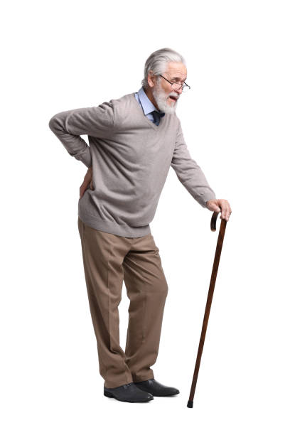 istock Senior man with walking cane suffering from back pain on white background 1653455012