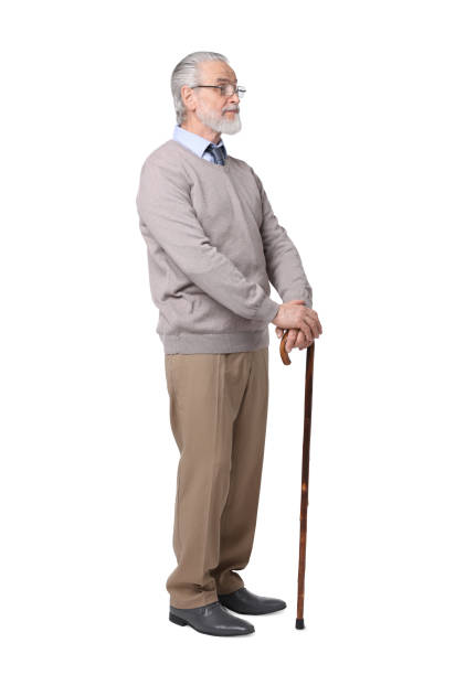 istock Senior man with walking cane on white background 1653455014