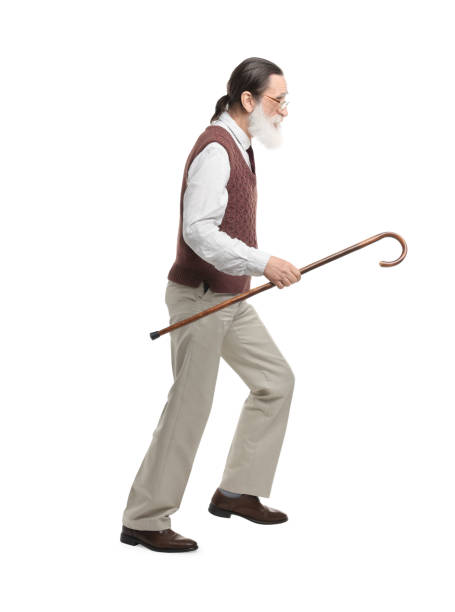 istock Senior man with walking cane on white background 1653455530