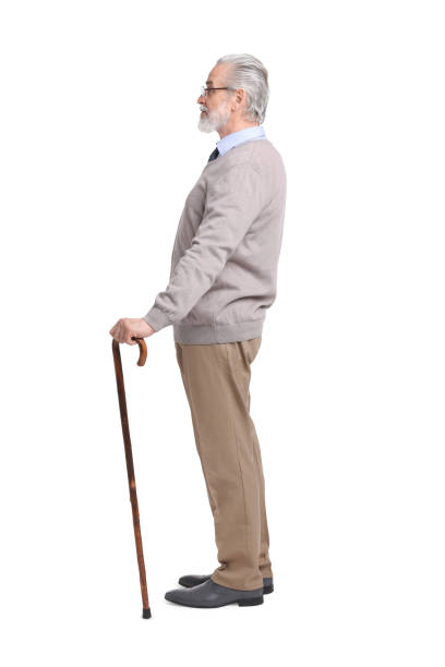 istock Senior man with walking cane on white background 1653455555