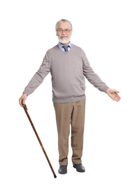istock Senior man with walking cane on white background 1653455563