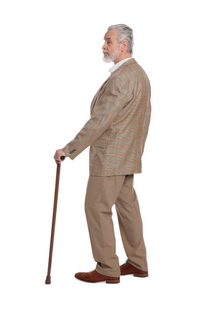 istock Senior man with walking cane on white background 1653456107