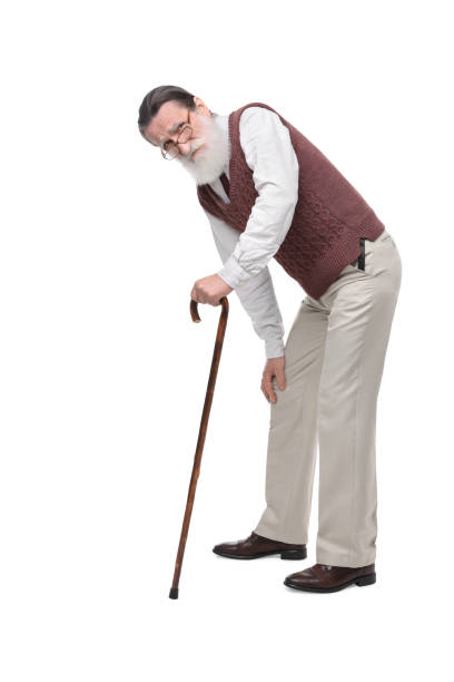 istock Stooped senior man with walking cane on white background 1653456636