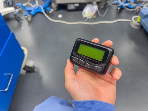 medical communication: A hospital pager signifies instant connection, urgency, and teamwork in healthcare