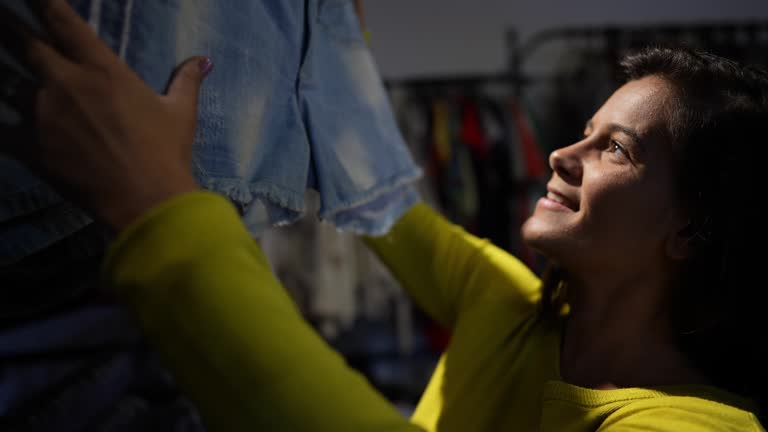 Mature woman shopping in a thrift store