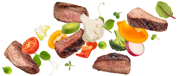 istock Falling steak salad ingredients isolated on white background 1653560789