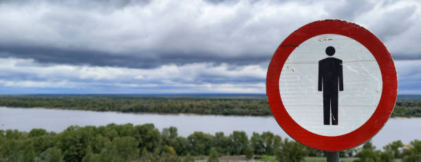 Restricted area Banner. No pedestrians road sign.
