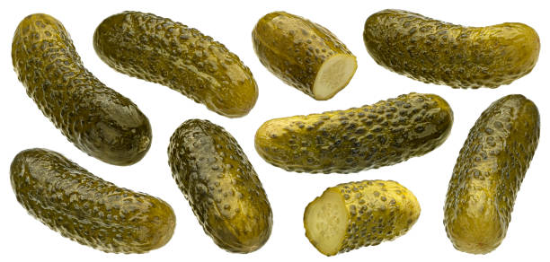 istock Marinated cucumbers, pickled gherkins isolated on white background 1653573244
