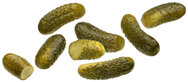 istock Marinated cucumbers, pickled gherkins isolated on white background 1653575977