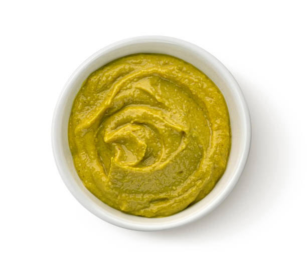 istock Homemade green hummus isolated on white background, top view 1653587775