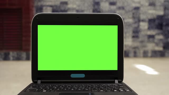 Laptop with Green Screen. Closeup. 4K Resolution.
