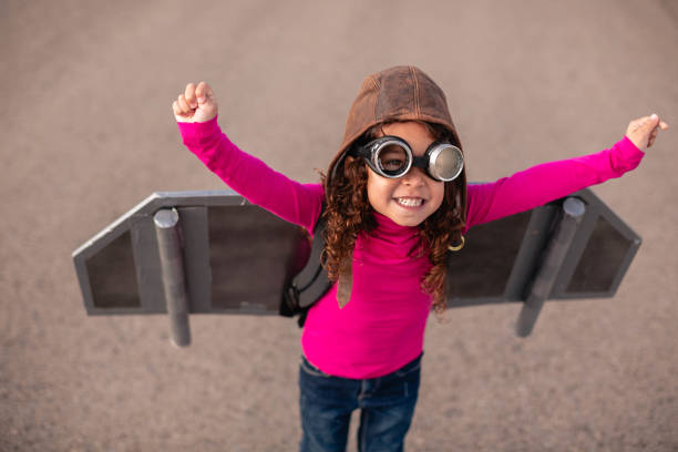 Jetpack Girl A girl wearing a jet pack is ready to take her dreams and sights to the stratosphere. day dreaming stock pictures, royalty-free photos & images