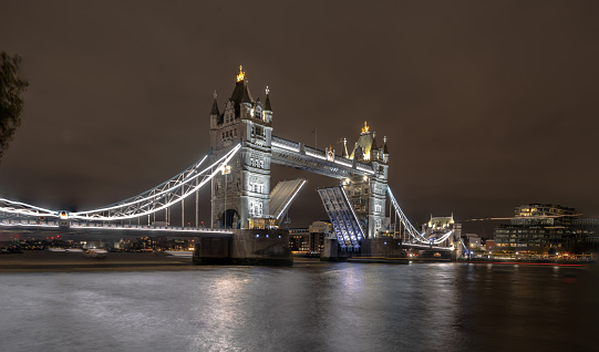 London. UK-01.27.2024. A night time view of Tower Bridge from the side of City Hall. Long exposure night photography.