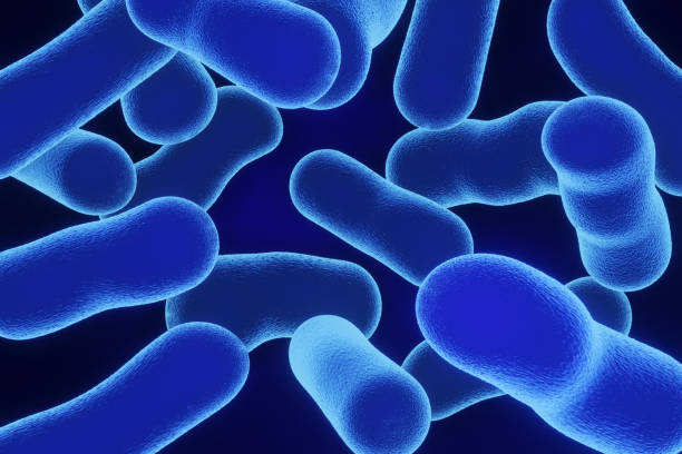 istock Blue neon light illuminated microorganism having spikes on its surface. Illustration of the concept of transmission of bacteria and diseases 1653770669
