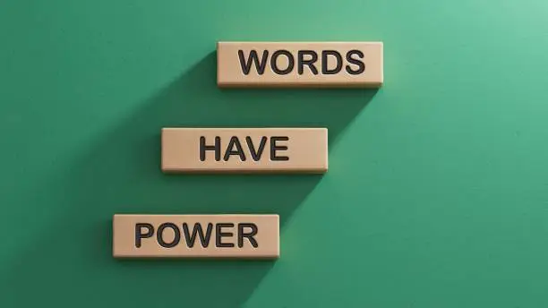 Photo of Words have power symbol. Wooden blocks with words Words have power.  Business and Words have power concept. Copy space.3D rendering on green background.