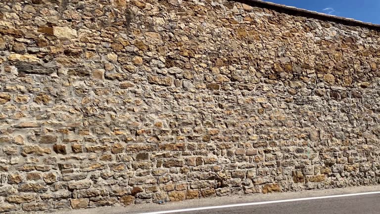 Stone wall next to road