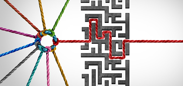 Team leadership success and strategic business solution as a group of connected diverse ropes solving a problem finding a path through a maze obstacle with 3D illustration elements.