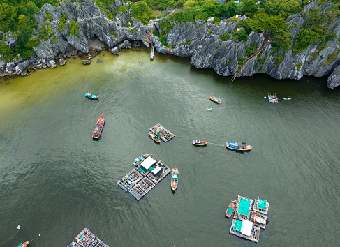 Abstract aerial photo of limestone island with blue sea typical of the island waters of Southwest Vietnam, tropical island, Nghe island, Kien Giang province