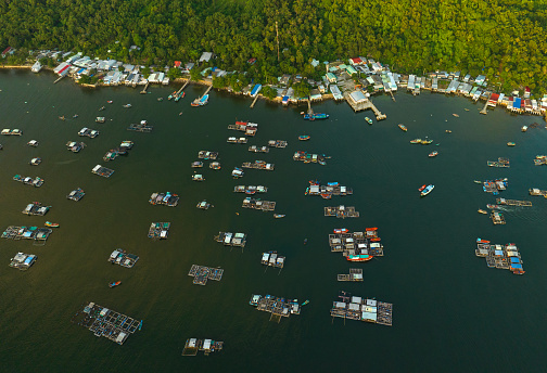 Abstract aerial photo of floating fish raft villages on Nghe island, Kien Giang province