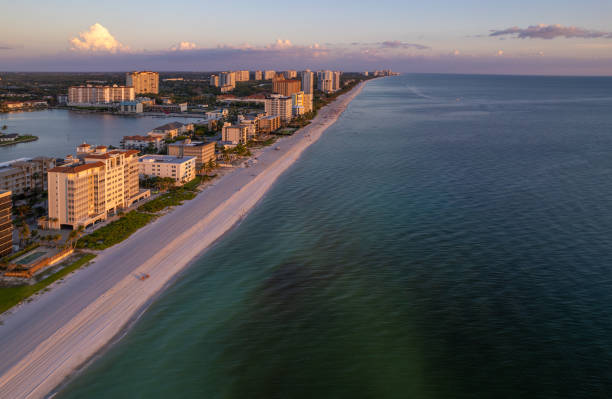 istock Aerial drone photo Naples Vanderbilt Beach Florida, at sunset 1654049968