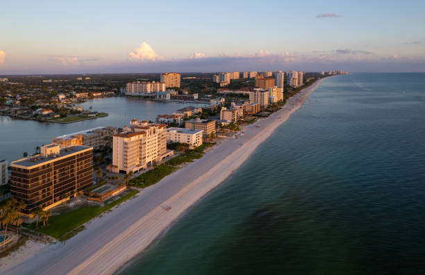 istock Aerial drone photo Naples Vanderbilt Beach Florida, at sunset 1654051604