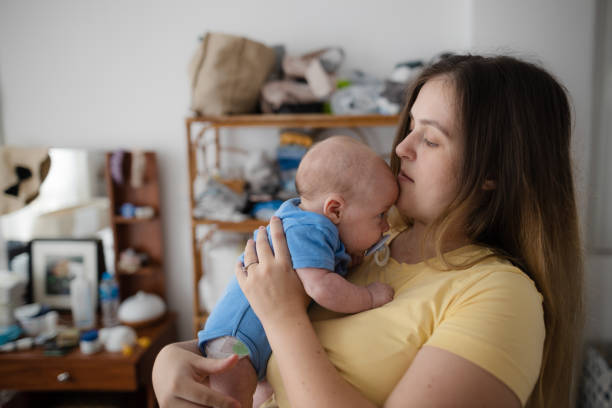 istock Young family with a newborn 1654076211