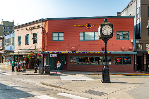 Juneau, Alaska - July 29, 2023: An old clock stands beside the street. View of Front street and S Franklin Street in the old town district of Juneau, Alaska.
