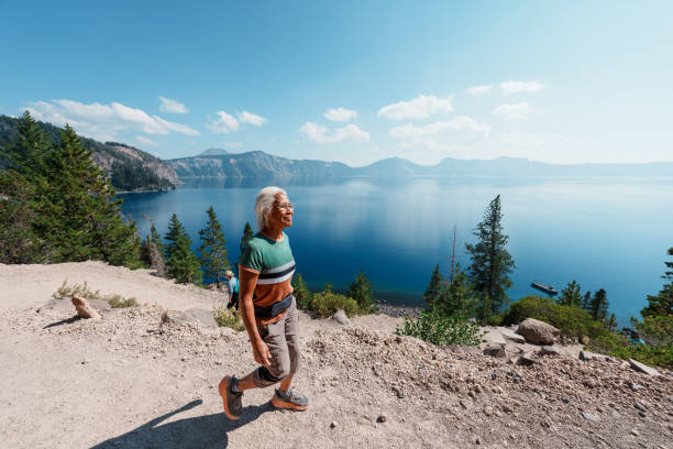 istock Happy and active senior woman hiking 1654168225