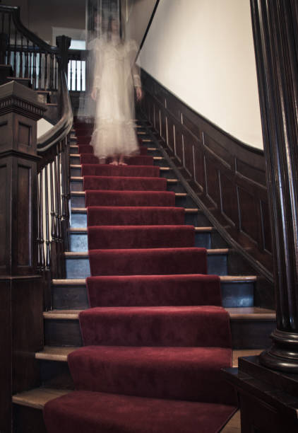 istock Ghost Woman on Haunted Staircase 165418509