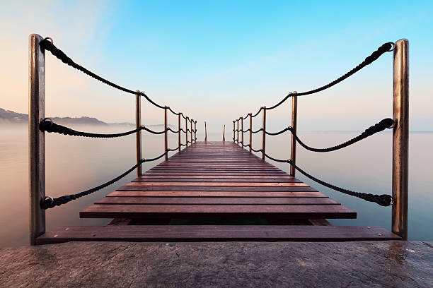 Wooden jetty in a sea with a morning fog (Strunjan, Slovenia).