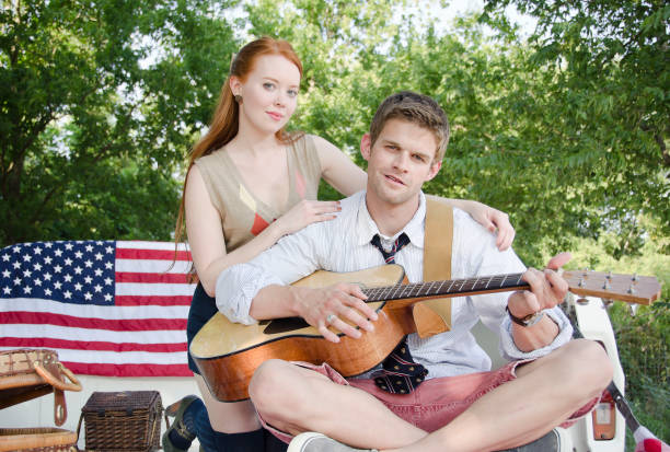 istock American man playing guitar for his girlfriend 165419368