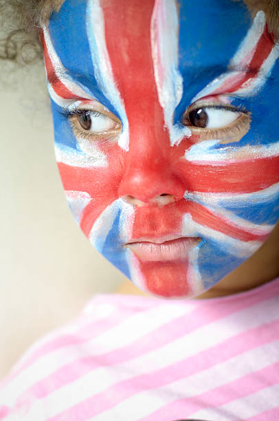 istock Girl (5-6) With Union Jack Face Painted Looking Serious 165419485