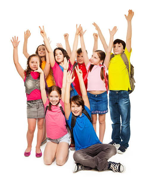 istock Group of happy kids lifting hands 165422235