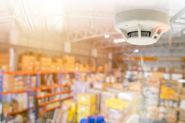 istock Fire Alarms for Warehouse Smoke Detector Fire Detector safety device setup at Cargo Storage Area ceiling 1654227475
