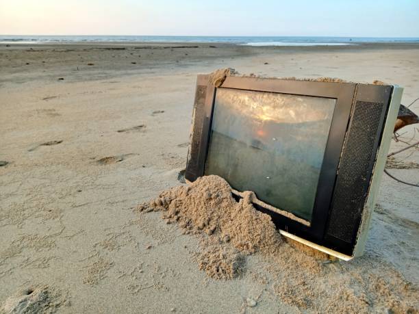istock Trash from a television on the beach 1654246506