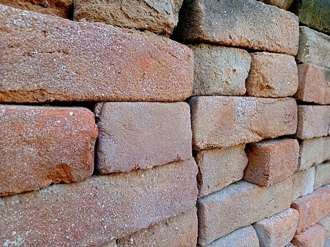 Red brick is a brick made from molded clay and then fired at a high temperature so that it becomes completely dry, hardened and reddish in color.