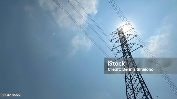 High Voltage Post High Voltage Tower With Blue Sky Background Stock Photo - Download Image Now