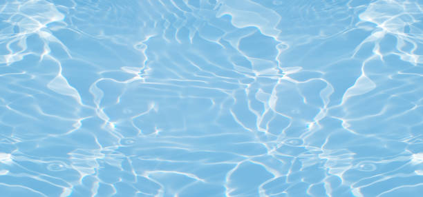 istock Blue water with ripples on the surface. Defocus blurred transparent blue colored clear calm water surface texture with splashes and bubbles. Water waves with shining pattern texture background. 1654302928