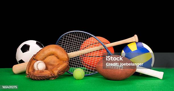 Arrangement Of Assorted Sports Equipment On Black Background Stock Photo - Download Image Now