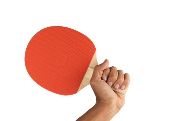 istock black male hand holding a ping pong racket isolated 1654319748