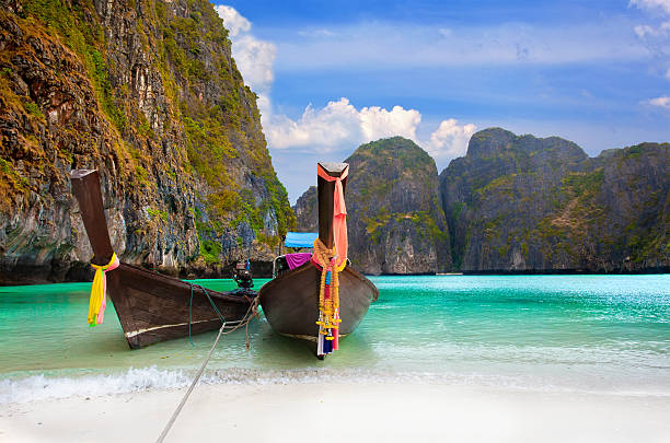 istock traditional Thai boats in the Maya Bay of Phi-Phi island 165432657