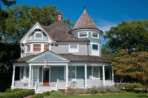 A Victorian style home with wrap-around porch