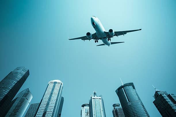 istock airplane with modern buildings skyline 165434410